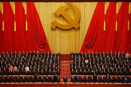 Chinese President Xi Jinping, front row center, stands with his cadres during the Communist song at the closing ceremony for the 19th Party Congress at the Great Hall of the People in Beijing on Oct. 24, 2017. China's ruling Communist Party is holding its twice-a-decade national congress starting Sunday, Oct. 16, 2022. That's where President Xi Jinping is expected to receive a third five-year term as the uncontested head of the party, government and military of the world's second-largest economy