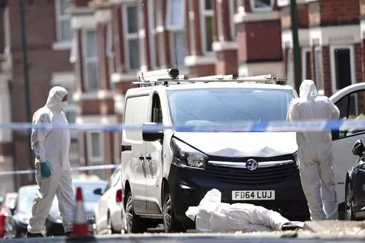 Police forensics officers search a white van on the corner of Maples Street and Bentinck Road in Nottingham, as three people have been found dead in the city in what police described as a "horrific and tragic incident". A 31-year-old man has been arrested on suspicion of murder after two people were found dead in the street in Ilkeston Road just after 4am on Tuesday. A third man was found dead in Magdala Road, Nottinghamshire Police said. Another three people are in hospital after someone tried 