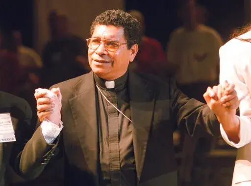 Bishop Carlos Ximenes Belo of East Timor, sings along with participants at the National Catholic Gathering for Jubilee Justice held on the UCLA Campus in Los Angeles, on July 17, 1999. Belo has been accused in a Dutch magazine article of sexually abusing boys in East Timor in the 1990s, rocking the Catholic Church in the impoverished nation and forcing officials at the Vatican and his religious order to scramble to provide answers. (AP Photo/Neil Jacobs, File)