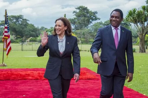 U.S. Vice President Kamala Harris, left, is greeted by Zambian President Hakainde Hichilema in Lusaka, Zambia, Friday March 31, 2023. Harris is on the last leg of a a seven-day African visit that took her to Ghana and Tanzania. (AP Photo/Salim Dawood)