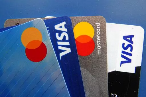 Credit cards as seen July 1, 2021, in Orlando, Fla. A low credit score can hurt your ability to take out a loan, secure a good interest rate, or increase a credit card spending limit. (AP Photo/John Raoux, File)