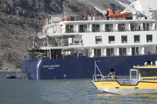 A view of the Ocean Explorer, a Bahamas-flagged Norwegian cruise ship with 206 passengers and crew, which has run aground in northwestern Greenland, on Tuesday, Sept. 12, 2023. The 104.4-meter (343-foot) long and 18-meter (60 foot) wide Ocean Explorer ran aground on Monday in Alpefjord in the Northeast Greenland National Park. It's the world’s largest and most northerly national park and is known for icebergs and the musk oxen that roam the coast. According to authorities no one on board was i