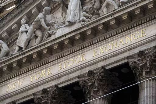 The New York Stock Exchange signage glistens in the noon sun on October 4, 2023, in New York. (AP Photo/J. David Ake, File)