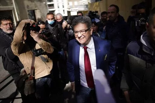 FILE- French far-left candidate Jean-Luc Melenchon leaves after voting in the first round of the presidential election at a polling station, April 10, 2022 in Marseille, southern France. A month before the first round of voting, the campaign for the 577 seats in France’s lower house of parliament has been brutal. After losing to Macron in the April presidential election, far-right leader Marine Le Pen now faces a challenge from her political nemesis, hard-left leader Jean-Luc Melenchon who has