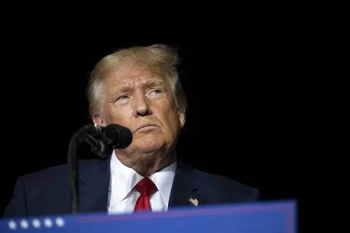 Former President Donald Trump pauses while speaking at a rally at the Minden Tahoe Airport in Minden, Nev., on Oct. 8, 2022. Trump is scheduled to answer questions under oath, Wednesday, Oct. 19, 2022, in a lawsuit filed by E. Jean Carroll, a magazine columnist who says the Republican raped her in the mid-1990s in a department store dressing room. (AP Photo/José Luis Villegas, Pool, File)