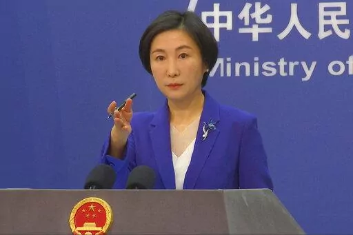 Chinese Foreign Ministry spokesperson Mao Ning gestures during a press conference at the Ministry of Foreign Affairs in Beijing, Thursday, Oct 13, 2022. China said Tuesday, Feb. 7, 2023, it will “resolutely safeguard its legitimate rights and interests” over the shooting down of a suspected Chinese spy balloon by the United States, as relations between the two countries deteriorate further. (AP Photo/Liu Zheng, File)