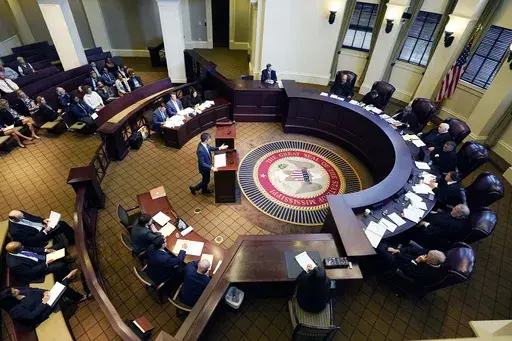 Mississippi Supreme Court justices including Justice Jim Kitchens, seated at right, fourth from top, listen to arguments, July 6, 2023, in Jackson, Miss. (AP Photo/Rogelio V. Solis, File)