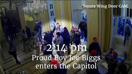 This image from video from a police worn body camera from the Jan. 6 riot at the U.S. Capitol, was played as a committee exhibit as the House select committee investigating the the Jan. 6 attack on the U.S. Capitol, held a hearing Thursday, June 9, 2022, on Capitol Hill in Washington. (House Select Committee via AP)