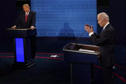 Democratic presidential candidate former Vice President Joe Biden, right, answers a question as President Donald Trump listens during the second and final presidential debate Oct. 22, 2020, in Nashville, Tenn. Twelve news organizations issued a joint statement calling on the presumptive presidential nominees President Biden and former President Trump to agree to debates during the 2024 campaign. ABC, CBS, CNN, Fox, PBS, NBC, NPR and The Associated Press all signed on to the letter. (AP Photo/Mor