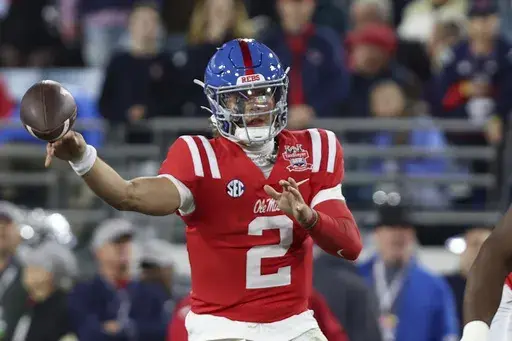 Mississippi quarterback Jaxson Dart (2) throws a pass during the first quarter of the Gator Bowl NCAA college football game against Duke, Thursday, Jan. 2, 2025, in Jacksonville, Fla. (AP Photo/Gary McCullough)