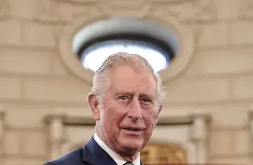 In this Wednesday, March 29, 2017 file photo, Britain's Prince Charles smiles during a welcoming ceremony at the Cotroceni Presidential Palace in Bucharest, Romania. Prince Charles has been preparing for the crown his entire life. Now, that moment has finally arrived. Charles, the oldest person to ever assume the British throne, became king on Thursday Sept. 8, 2022, following the death of his mother, Queen Elizabeth II.  (AP Photo/Vadim Ghirda, File)