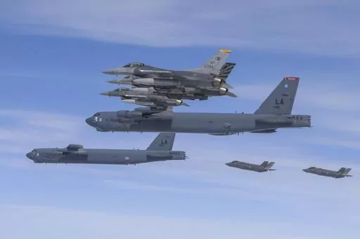 In this photo provided by the South Korean Defense Ministry, U.S. B-52H bombers, center, and F-16 fighter jets and South Korean Air Force F-35A fighter jets, right bottom, fly over the Korean Peninsula during a joint air drill in South Korea on April 14, 2023. The United States flew nuclear-capable bombers to the Korean Peninsula on Friday, June 30, in its latest show of force against North Korea, days after the North staged massive anti-U.S. rallies in its capital. (South Korea Defense Ministry