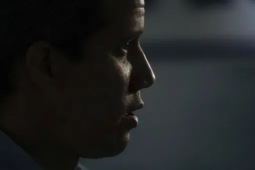 Opposition leader Juan Guaido speaks during an interview with the Associated Press in Caracas, Venezuela, Thursday, Feb. 10, 2022. A little more than two years ago Guaido was showered with bipartisan applause during President Donald Trump´s state of the union speech, but now he has not been invited to the Summit of the Americas that is taking place on the second week of June in the United States. (AP Photo/Ariana Cubillos, File)