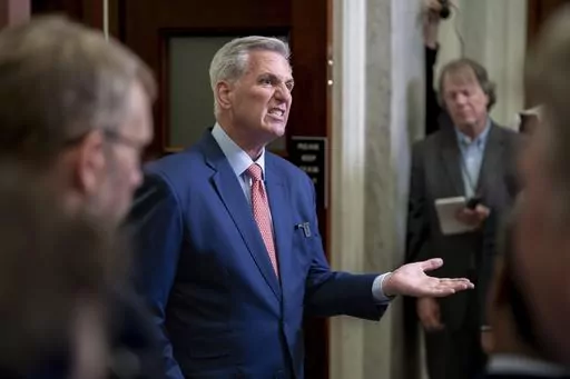 Speaker of the House Kevin McCarthy, R-Calif., talks to reporters outside his office about calls for an impeachment inquiry of President Joe Biden, at the Capitol in Washington, July 25, 2023. Congressional leaders are pitching a stopgap government funding package to avoid a federal shutdown after next month. McCarthy raised the idea to House Republicans on a members-only call. On Tuesday, Senate Majority Leader Chuck Schumer said the two leaders had spoken about such a temporary measure. (AP Ph