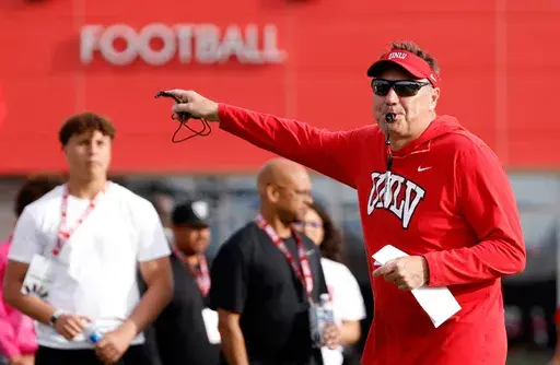 UNLV football head coach Dan Mullen blows on a whistle during a team practice in Las Vegas, Thursday, March 27, 2025. (Bizuayehu Tesfaye/Las Vegas Review-Journal via AP)