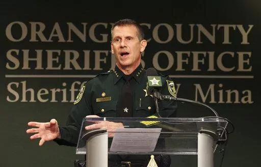 Orange County Sheriff John Mina addresses the media during a press conference about multiple shootings, Wednesday, Feb. 22, 2023, in Orlando, Fla. A central Florida television journalist and a little girl were fatally shot Wednesday afternoon near the scene of a fatal shooting from earlier in the day, authorities said. Mina said that they’ve detained Keith Melvin Moses, 19, who they believe is responsible for both shootings in the Orlando-area neighborhood. (Ricardo Ramirez Buxeda/Orlando Sent