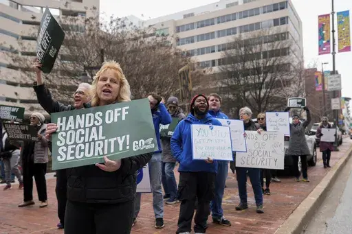 Demonstrators gather outside of the Edward A. Garmatz United States District Courthouse in Baltimore, on Friday, March 14, 2025, before a hearing regarding the Department of Government Efficiency's access to Social Security data. (AP Photo/Stephanie Scarbrough)