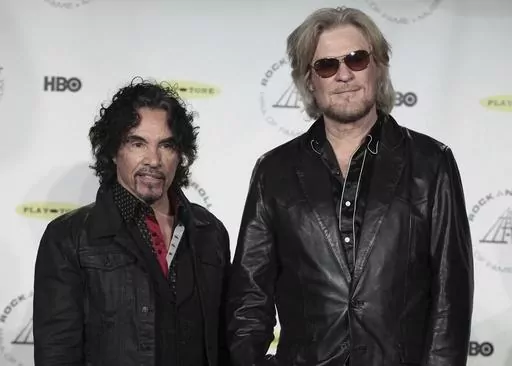 Hall of Fame Inductees, Hall & Oates, John Oates and Daryl Hall appear in the press room at the 2014 Rock and Roll Hall of Fame Induction Ceremony on April, 10, 2014, in New York. Hall has sued his longtime music partner John Oates, arguing that his plan to sell off his share of a joint venture would violate a business agreement the duo had. (Photo by Andy Kropa/Invision/AP, File)