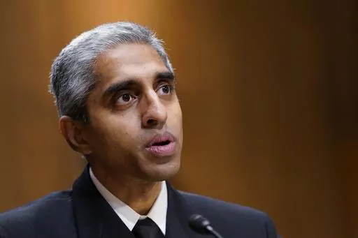 U.S. Surgeon General Dr. Vivek Murthy testifies before the Senate Finance Committee on Capitol Hill in Washington, on Feb. 8, 2022. The Surgeon General is warning there is not enough evidence to show that social media is safe for young people — and is calling on tech companies, parents and caregivers to take "immediate action to protect kids now." (AP Photo/Susan Walsh, File)