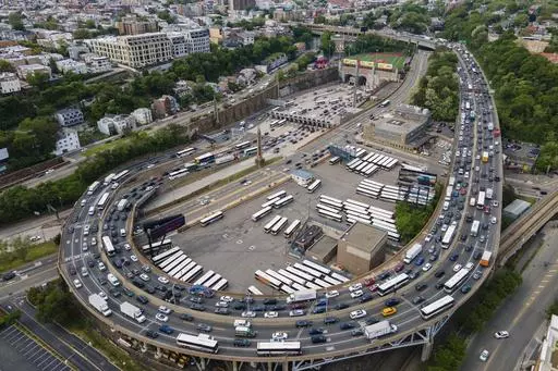 People drive vehicles in and out of the Lincoln Tunnel, coming and going between midtown Manhattan in New York City and New Jersey, in Weehawken, New Jersey, on Friday, May 12, 2023. New Jersey has filed a federal lawsuit aimed at stopping New York's first-in-the-nation plan to charge big tolls to drive into the most visited parts of Manhattan, arguing that New Jersey residents and towns will bear the brunt of the higher tolls while receiving little benefit. (AP Photo/Ted Shaffrey, File)