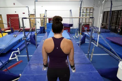Angela Fuller, 44, trains at 5280 Gymnastics, Wednesday, July 24, 2024, in Littleton, Colo. (AP Photo/Brittany Peterson)