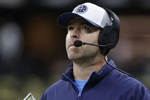 Tennessee Titans head coach Brian Callahan watches during the second half of an NFL preseason football game against the New Orleans Saints, Sunday, Aug. 25, 2024, in New Orleans. (AP Photo/Butch Dill)