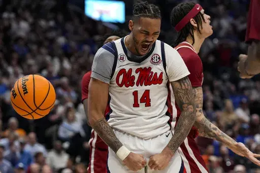 Mississippi guard Dre Davis (14) celebrates a basket against Arkansas during the second half of an NCAA college basketball game at the Southeastern Conference tournament, Thursday, March 13, 2025, in Nashville, Tenn. (AP Photo/George Walker IV)