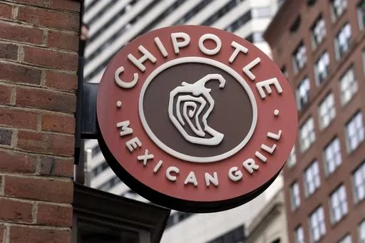 The Chipotle Mexican Grill logo is seen on a storefront, Friday, Oct. 14, 2022, in Boston. On Monday, March 27, 2023, union officials said Chipotle Mexican Grill has agreed to pay $240,000 to former employees as part of a settlement stemming from a complaint that the company violated federal law by closing a restaurant where workers wanted to unionize. (AP Photo/Michael Dwyer, File)
