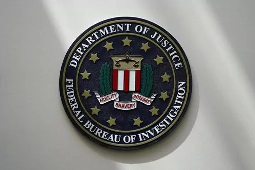 An FBI seal is seen on a wall on Aug. 10, 2022, in Omaha, Neb. A former American diplomat who served as U.S. ambassador to Bolivia has been arrested in a long-running FBI counterintelligence investigation, accused of secretly serving as an agent of Cuba’s government, The Associated Press has learned. (AP Photo/Charlie Neibergall, File)
