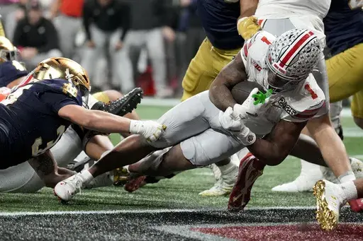 Ohio State running back Quinshon Judkins scores against Notre Dame during second half of the College Football Playoff national championship game Monday, Jan. 20, 2025, in Atlanta. (AP Photo/Brynn Anderson)