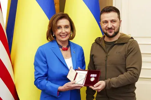 In this image released by the Ukrainian Presidential Press Office on Sunday, May 1, 2022, Ukrainian President Volodymyr Zelenskyy, right, awards the Order of Princess Olga, the third grade, to U.S. Speaker of the House Nancy Pelosi in Kyiv, Ukraine, Saturday, April 30, 2022. Pelosi, second in line to the presidency after the vice president, is the highest-ranking American leader to visit Ukraine since the start of the war, and her visit marks a major show of continuing support for the country's 
