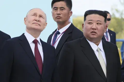Russian President Vladimir Putin, left, and North Korea's leader Kim Jong Un examine a launch pad of Soyuz rockets during their meeting at the Vostochny cosmodrome outside the city of Tsiolkovsky, about 200 kilometers (125 miles) from the city of Blagoveshchensk in the far eastern Amur region, Russia, on Wednesday, Sept. 13, 2023. North Korean leader Kim hailed the country's relationship with Russia on Wednesday, June 12, 2024, as reports suggest that Russian President Putin will soon visit the 