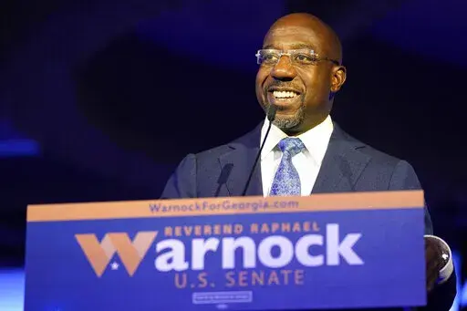 Democratic Sen. Raphael Warnock speaks during an election night watch party on Tuesday, Nov. 8, 2022, in Atlanta. (AP Photo/John Bazemore)