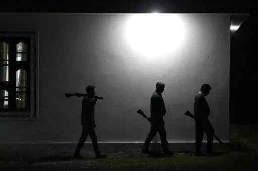 Village Defense Group members patrol during night at Muradpur village in Rajouri, India, Feb. 8, 2023. Days after seven Hindus were killed in the village in disputed Kashmir, hundreds of residents staged protests across the region's Hindu-dominated areas. In response, Indian authorities revived a government-sponsored militia and began rearming and training villagers. The militia, officially called the “Village Defense Group,” was initially formed in the 1990s as the first line of defense aga