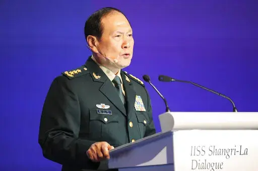 China's Defense Minister General Wei Fenghe speaks at a plenary session during the 19th International Institute for Strategic Studies (IISS) Shangri-la Dialogue, Asia's annual defense and security forum, in Singapore, Sunday, June 12, 2022. (AP Photo/Danial Hakim)