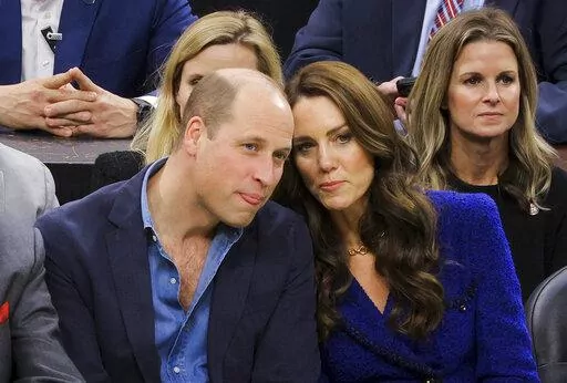 Britain's Prince William and Kate, Princess of Wales, watch the NBA basketball game between the Boston Celtics and the Miami Heat on Wednesday, Nov. 30, 2022, in Boston. (Brian Snyder/Pool Photo via AP)