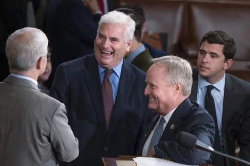 FILE—House Majority Whip Tom Emmer, R-Minn., center, is flanked by Rep. Patrick McHenry, R-N.C., the temporary leader of the House of Representatives, left, and Rep. David Joyce, R-Ohio, right, as lawmakers convene to hold a third ballot to elect a speaker of the House, at the Capitol in Washington, Friday, Oct. 20, 2023. After the rejection of former speaker Kevin McCarthy, Majority Leader Steve Scalise and Judiciary Committee Chair Jim Jordan by the GOP caucus, Emmer is emerging as the newes