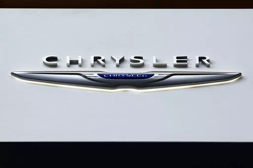 The Chrysler logo is on display at the Pittsburgh International Auto Show, Feb. 11, 2016, in Pittsburgh. On Saturday, June 8, 2024, the National Highway Traffic Safety Administration announced that Chrysler is recalling more than 211,000 SUVs and pickup trucks in the U.S., due to a software malfunction that could disable the cars' electronic stability control systems. (AP Photo/Gene J. Puskar, File)