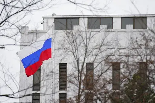 The Russian flag flies outside the Embassy of Russia in Washington, Feb. 24, 2022. The United States and allies are stepping up sanctions against Russia over its invasion of Ukraine.  (AP Photo/Patrick Semansky, File)
