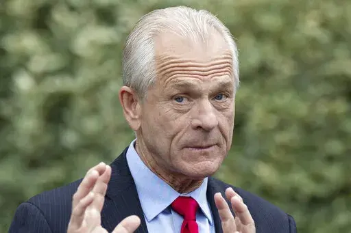 White House trade adviser Peter Navarro speaks with reporters at the White House, June 18, 2020, in Washington. The House committee investigating the Capitol riot has set a vote for next week to consider contempt of Congress charges for two aides of former President Donald Trump. The committee will meet Monday to discuss whether to recommend referring for potential prosecution Trump’s former trade adviser, Peter Navarro, and Dan Scavino, the onetime chief of staff for communications. (AP Photo