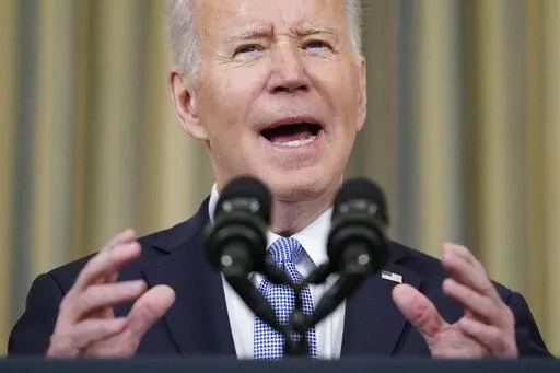 President Joe Biden speaks about the March jobs report in the State Dining Room of the White House, Friday, April 1, 2022, in Washington. (AP Photo/Patrick Semansky)