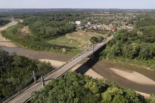 The Integration border bridge connects Assis, Brazil, left, and Iñapari, Peru, June 20, 2024. (AP Photo/Martin Mejia, File)