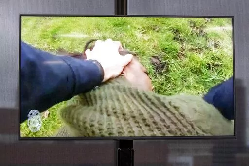 A TV display shows video evidence of a Grand Rapids police officer struggling with and shooting Patrick Lyoya at Grand Rapids City Hall on Wednesday, April 13, 2022. Lyoya, 26, was shot and killed about 8:10 a.m., on April 4, after what police said was a traffic stop. (Grand Rapids Police Department)