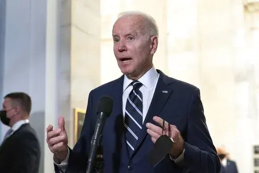 President Joe Biden speaks to the media after meeting privately with Senate Democrats, Thursday, Jan. 13, 2022, on Capitol Hill in Washington. (AP Photo/Jose Luis Magana)