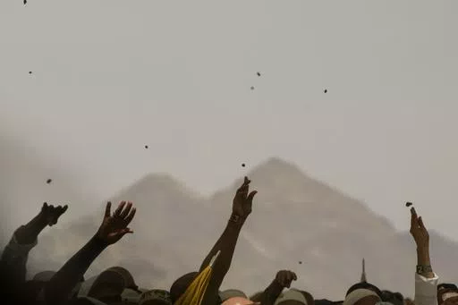Muslim pilgrims cast stones at pillars in the symbolic stoning of the devil during the annual Hajj, in Mina near the holy city of Mecca, Saudi Arabia, on June 30, 2023. Once a year, Muslim pilgrims coming to Saudi Arabia from around the world unite in a series of religious rituals and acts of worshipping God as they perform Hajj, one of the pillars of Islam. Among other rituals, pilgrims throw pebbles in a symbolic stoning of the devil. (AP Photo/Amr Nabil, File)