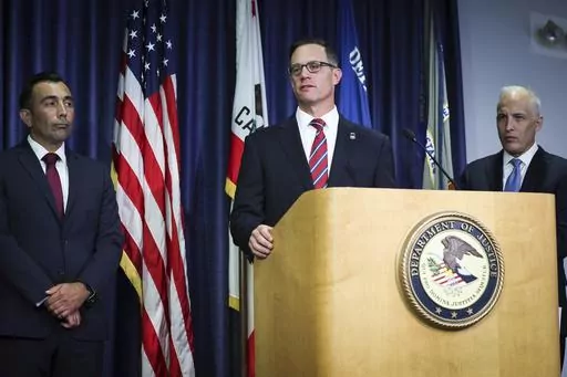 U.S. Attorney Randy S. Grossman for the Southern District of California, center, speaks during a press conference at the U.S. Attorney's Office for the Southern District of California on Thursday, Aug. 3, 2023, in San Diego. Two U.S. Navy sailors have been arrested and accused of providing sensitive military information to China — including details on wartime exercises, Naval operations and critical technical material, federal officials said Thursday. (Meg McLaughlin/The San Diego Union-Tribun