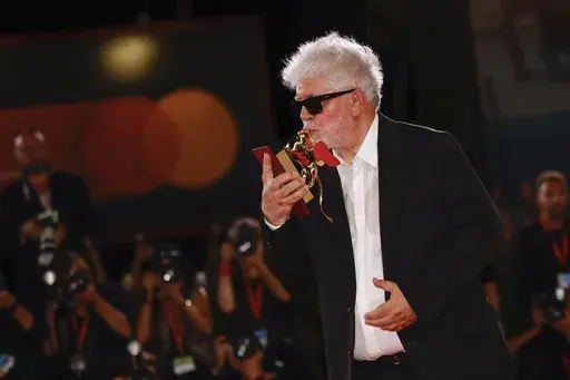 Pedro Almodovar, winner of the golden lion for best film for 'The Room Next Door', poses for photographers at the awards photo call during the closing ceremony of the 81st edition of the Venice Film Festival in Venice, Italy, on Saturday, Sept. 7, 2024. (Photo by Vianney Le Caer/Invision/AP)