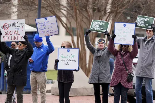 Demonstrators gather outside of the Edward A. Garmatz United States District Courthouse in Baltimore, on Friday, March 14, 2025, before a hearing regarding the Department of Government Efficiency's access to Social Security data. (AP Photo/Stephanie Scarbrough, File)