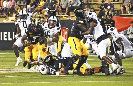Southern Mississippi running back Frank Gore Jr. breaks a tackle against Arkansas State during an NCAA college football game in Hattiesburg, Miss. on Saturday, Oct. 15, 2022. (Aimee Cronan/The Gazebo Gazette via AP)