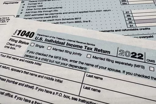 The Internal Revenue Service 1040 tax form for 2022 is seen on April 17, 2023. Majorities of U.S. taxpayers say the amount they pay in taxes is too high, with many saying that they receive a poor value for the taxes they do pay, according to a new poll from the University of Chicago Harris School of Public Policy and The Associated Press-NORC Center for Public Affairs Research. (AP Photo/Jon Elswick, File)